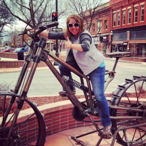 Heidi riding big bike in downtown Grand Junction Colorado HeidiTown Heidi riding big bike in downtown Grand Junction Colorado HeidiTown