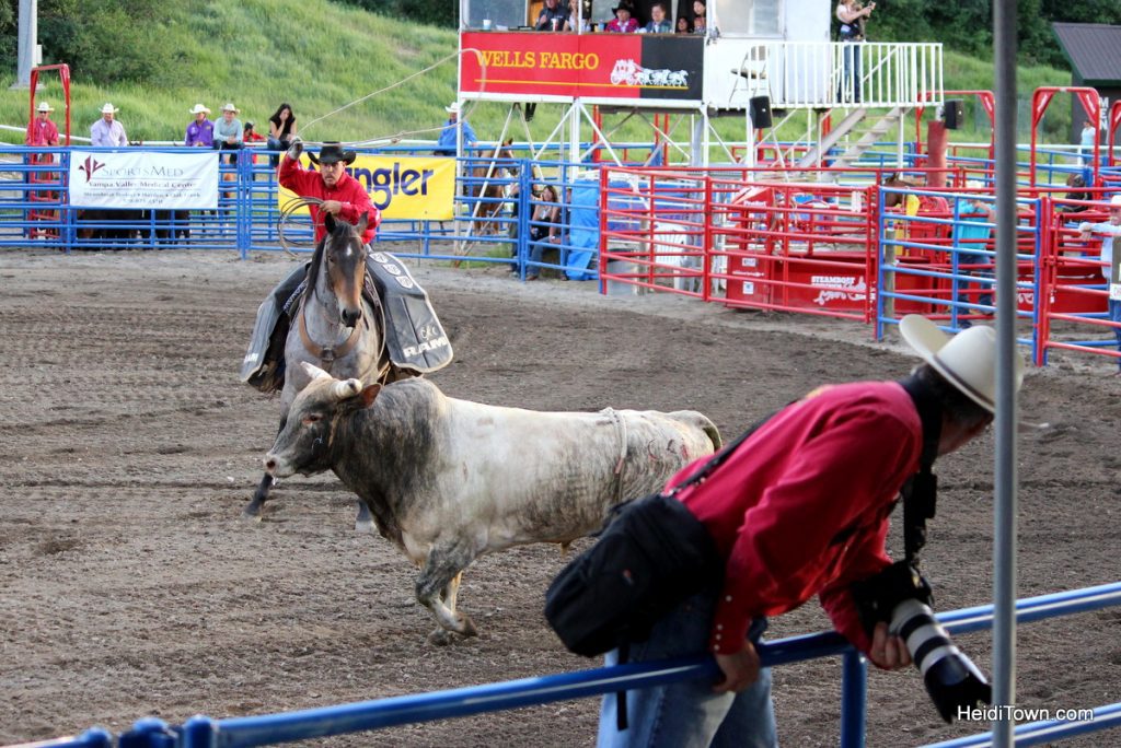 Kickin’ it at the Pro Rodeo in Steamboat Springs. Bull scares photographer. HeidiTown.com